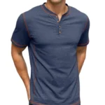 A man wearing a dark blue casual Henley shirt with contrasting brown stitching and short sleeves.